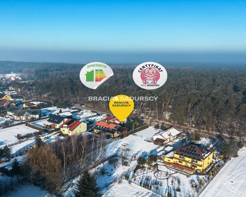 Dwa domy w otoczeniu Puszczy Niepołomickiej.