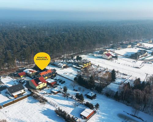 Dwa domy w otoczeniu Puszczy Niepołomickiej.