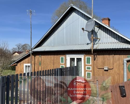 Drewniany dom na działce w Świeciechowie Dużym.