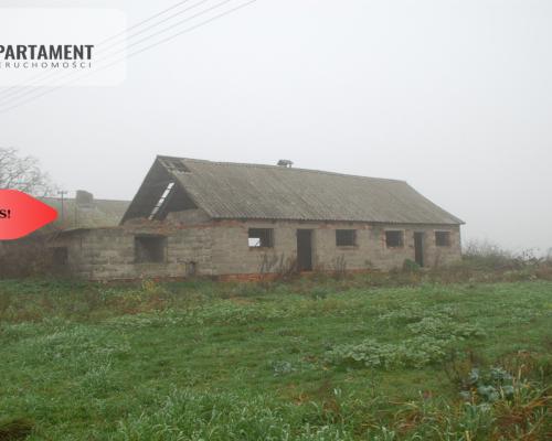 Działka budowlana z zabudowaniami Pigża.