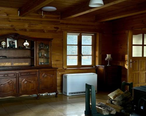 Drewniany dom z działką, sauną i garażem