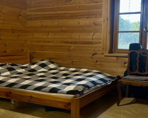 Drewniany dom z działką, sauną i garażem